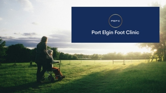 A picture of a senior person with a wound on a wheelchair looking at a sunset and greenery to signify a bright future lies ahead